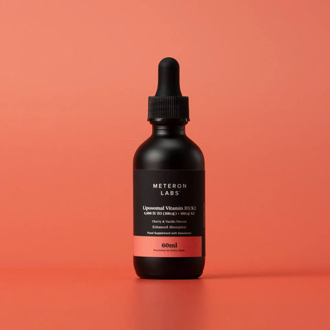 Black bottle with dropper labeled 'Meteoron Labs' on a red background
